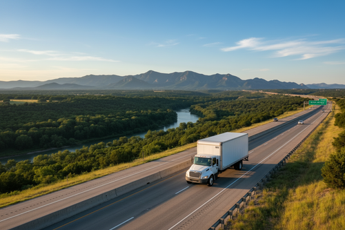Box truck driving on a highway to another state